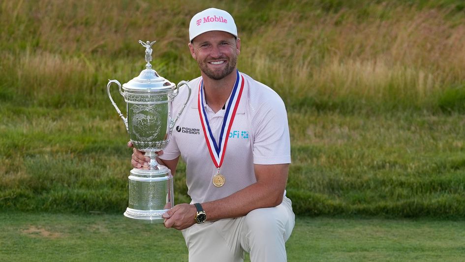 Wyndham Clark celebrates with the trophy