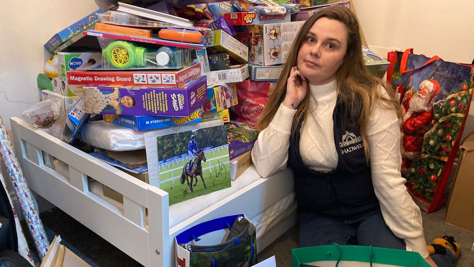 CJ Cooper with some of the presents and auction lots that have already been donated