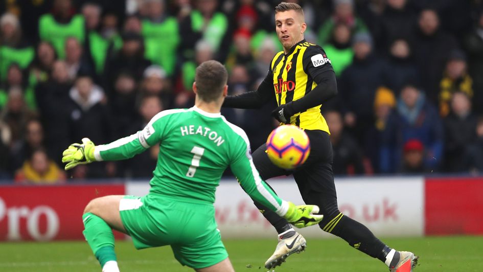 Watford's Gerard Deulofeu attempts to beat Burnley's Tom Heaton