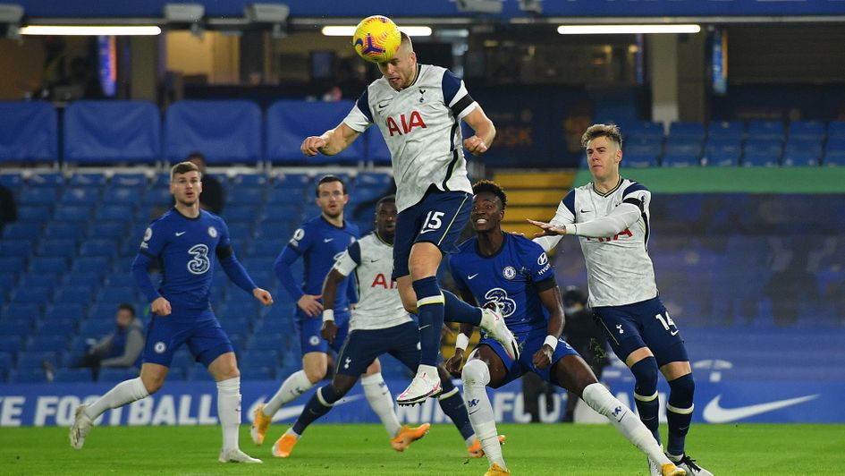 Eric Dier heads the ball clear
