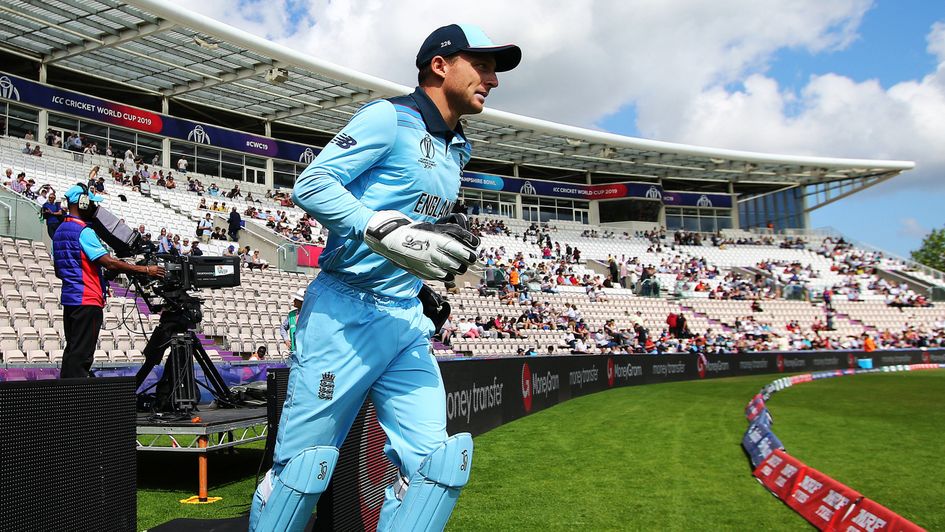 Jos Buttler leads England out