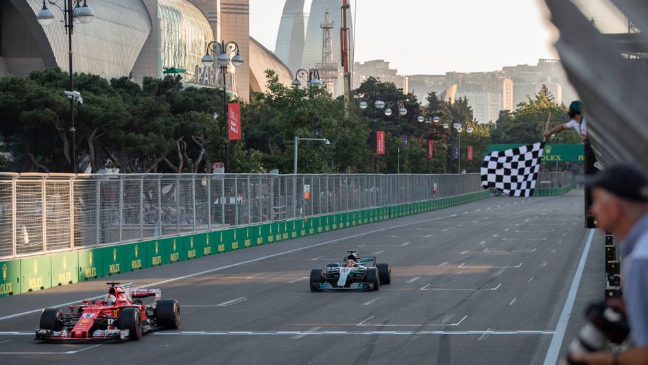 Vettel and hamilton cross the line in Baku