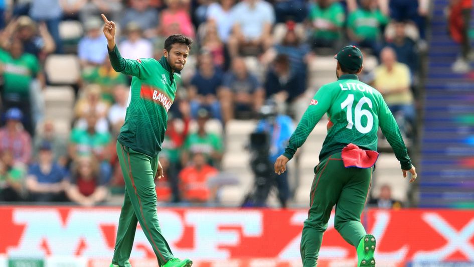 Bangladesh's Shakib Al Hasan (left) celebrates taking the wicket of Gulbadin Naib