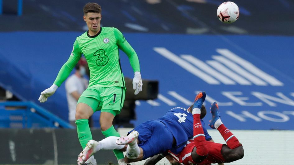 Kepa clears the ball after Chelsea team-mate Andreas Christensen tackles Liverpool's Sadio Mane to the ground, for which he was sent off