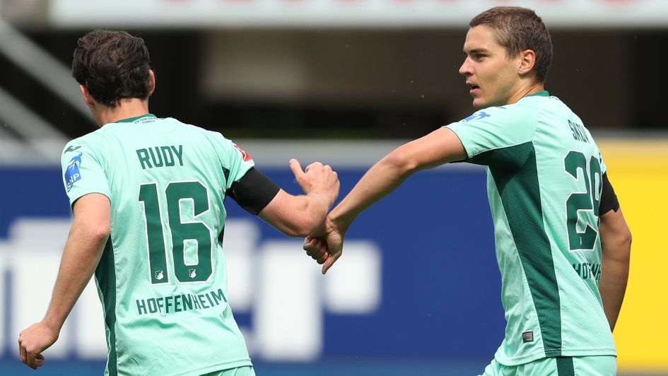 Sebastian Rudy and Robert Skov celebrate