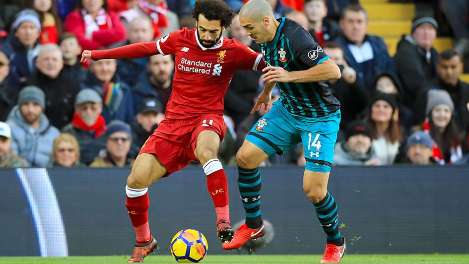 Mohamed Salah and Oriol Romeu battle for the ball
