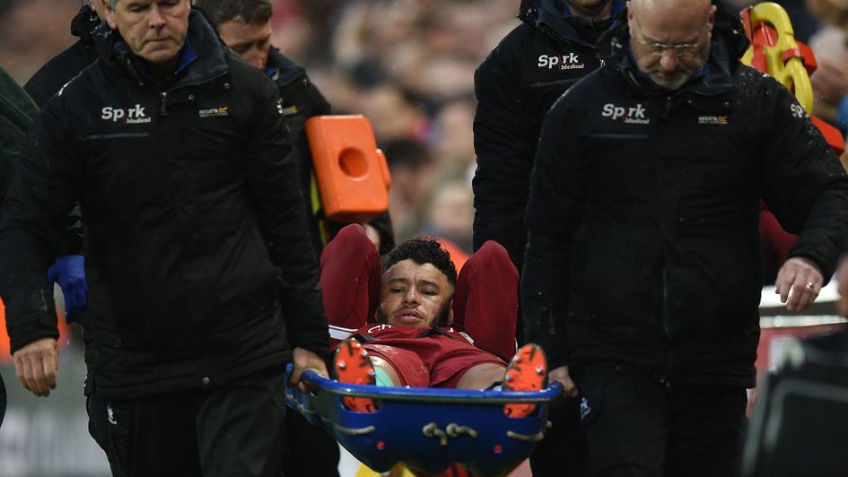 Alex Oxlade-Chamberlain is stretchered off during Liverpool v Roma