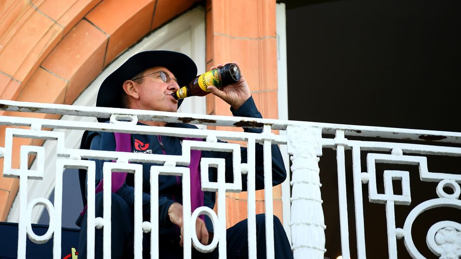 England cricket coach Trevor Bayliss celebrates with a drink