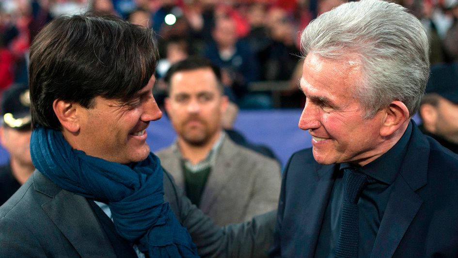 Sevilla's Vincenzo Montella (left) chats to Bayern's Jupp Heynckes
