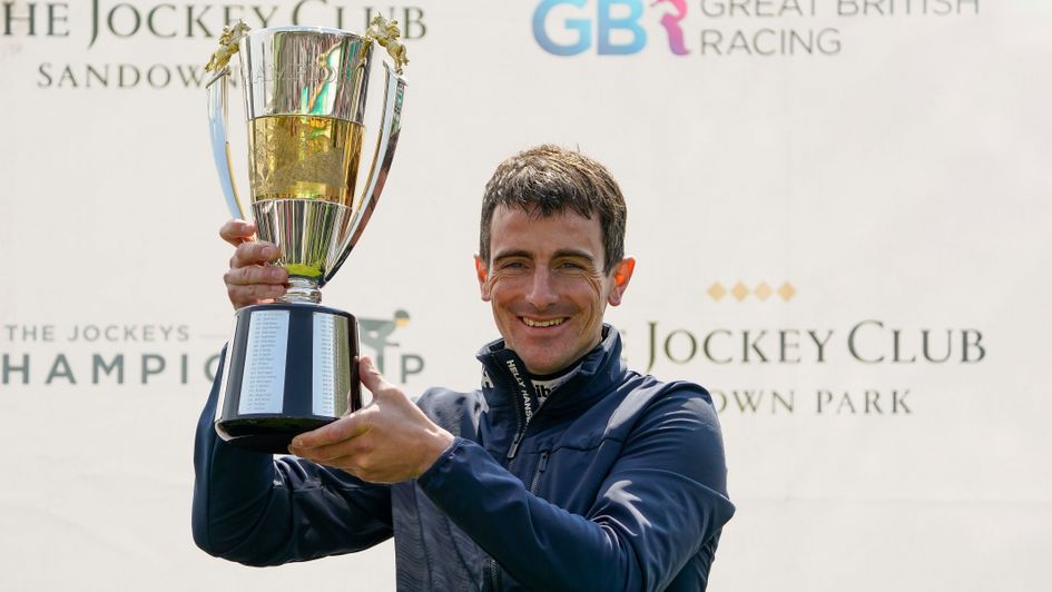 Brian Hughes celebrates with the trophy