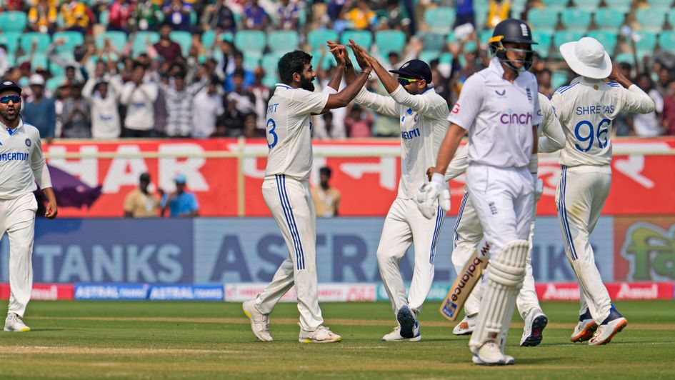 India celebrate the wicket of Joe Root
