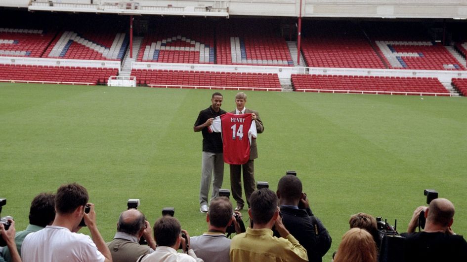 Arsene Wenger welcomes new signing Thierry Henry in 1999
