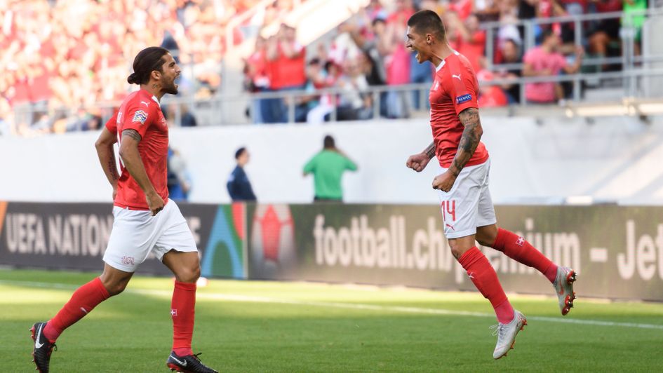 Steven Zuber (right) celebrates Switzerland's goal against Iceland with Ricardo Rodriguez