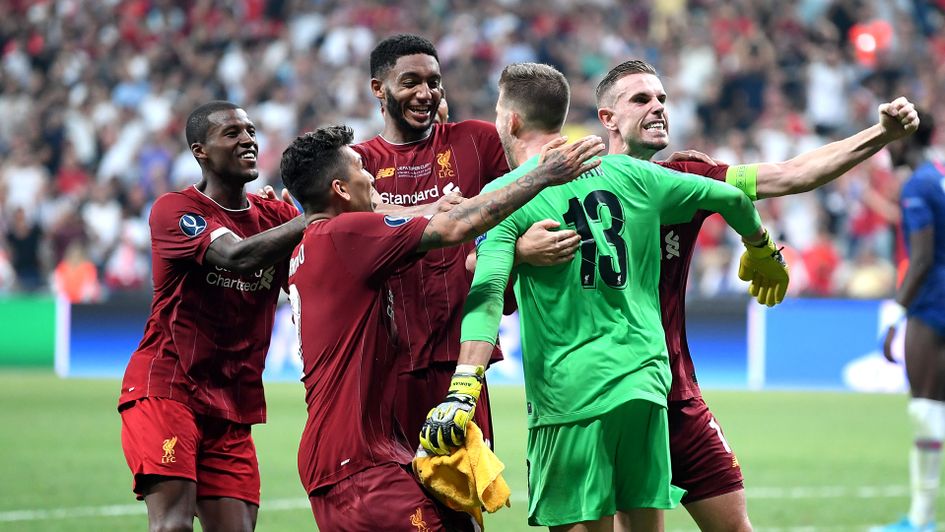 Adrian: Liverpool players celebrate with the goalkeeper after his heroics in the Super Cup win over Chelsea