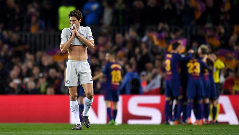 Marcos Alonso looks away as Barcelona celebrate