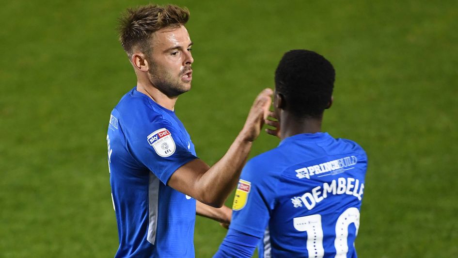Peterborough United's Matt Godden (right) celebrates a goal with Siriki Dembele