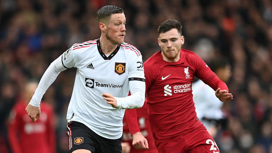 Wout Weghorst battles Andy Robertson for the ball