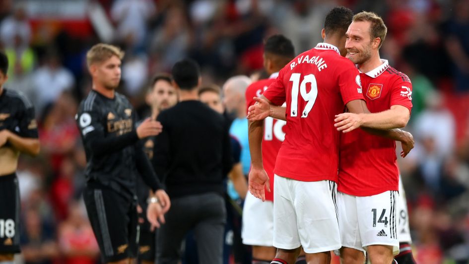 Christian Eriksen celebrates with Raphael Varane