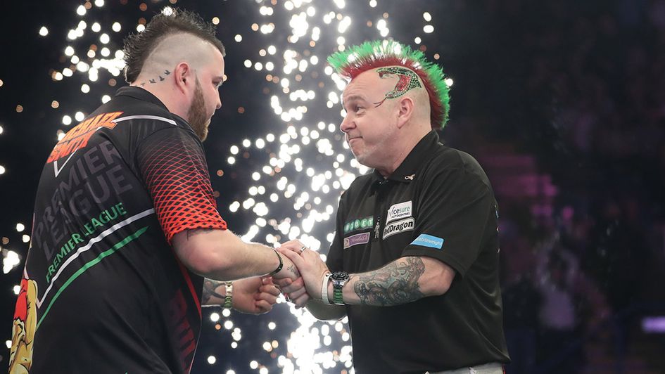 Michael Smith thrashed Peter Wright 7-1 (Picture by Lawrence Lustig/PDC)
