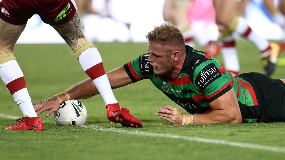 Tom Burgess stretches out to score