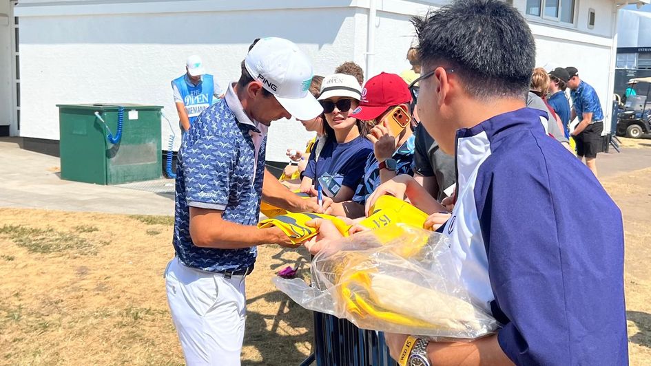 Joaquin Niemann signs autographs... with his left hand