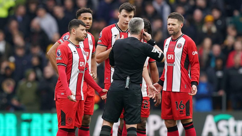 Sheffield United's Jack Robinson (not pictured) and team-mate Anel Ahmedhodzic (centre left) during the Premier League match at Molineux
