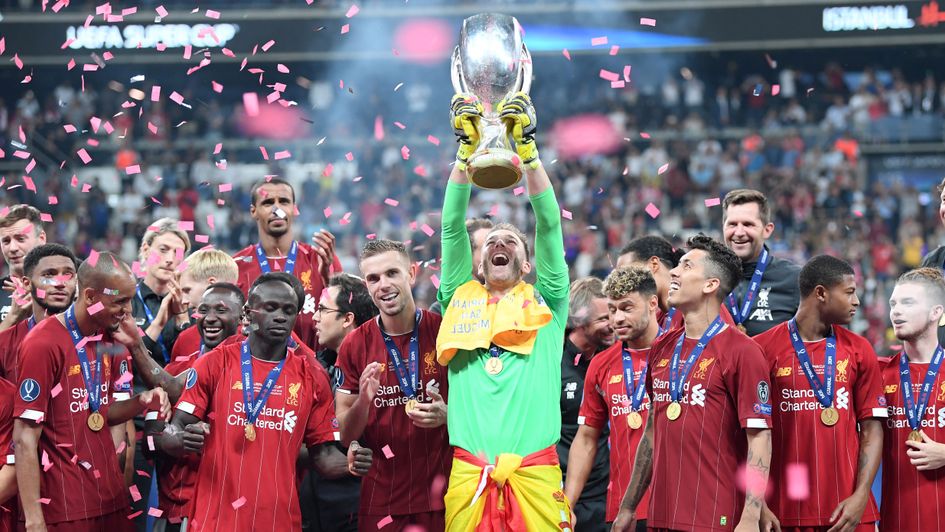 Adrian: Liverpool goalkeeper lifts the Super Cup trophy after his penalty heroics