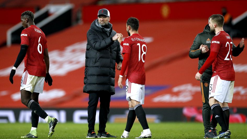 Jurgen Klopp bumps fists with Manchester United's Bruno Fernandes