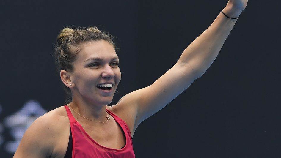 Simona Halep celebrates victory over Jelena Ostapenko in Beijing