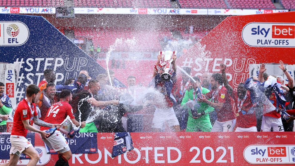Morecambe celebrate after securing promotion to League One