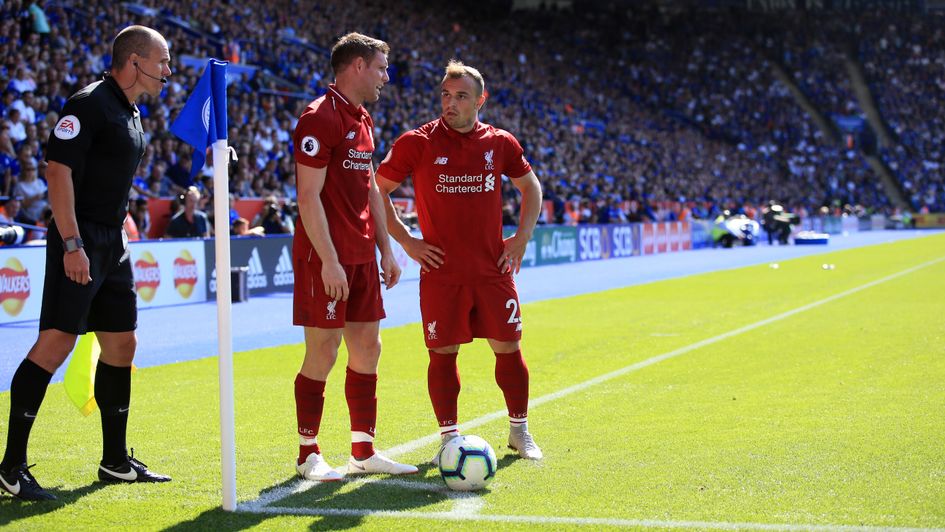 Liverpool's James Milner (left) and Xherdan Shaqiri (right) line up a corner