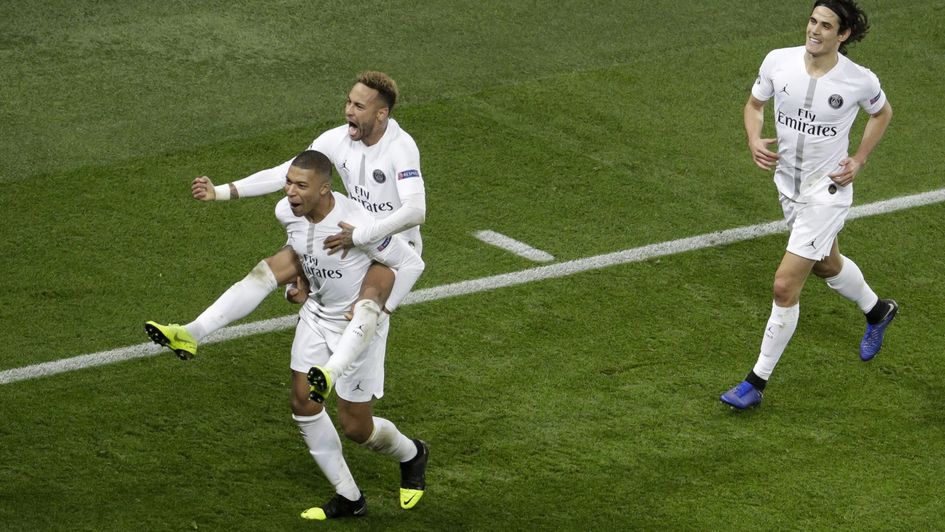 Kylian Mbappe (front, left), Neymar and Edinson Cavani (right) celebrate PSG's goal against Liverpool
