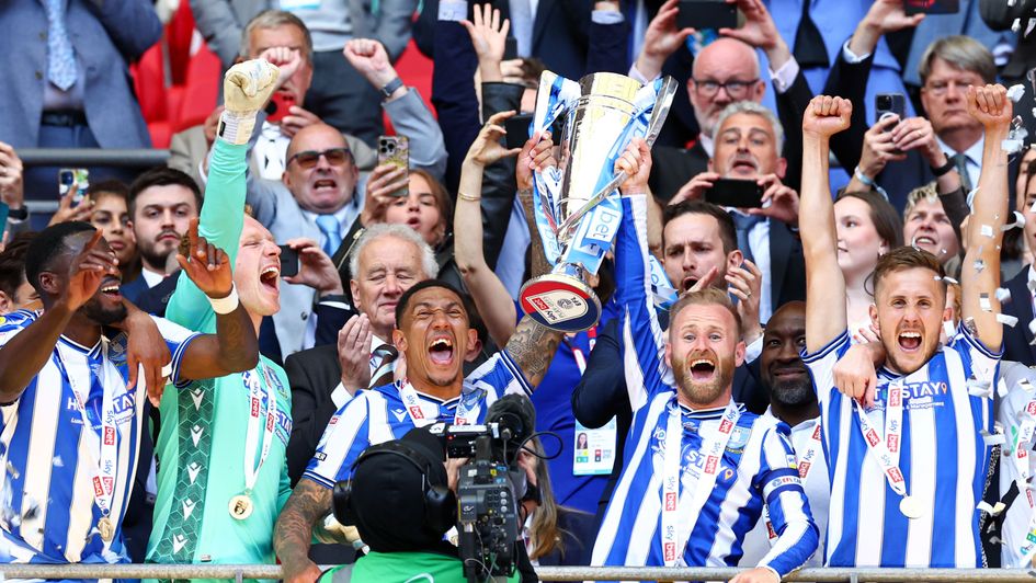 Sheffield Wednesday players celebrate with the Sky Bet League One Play-off Final Trophy