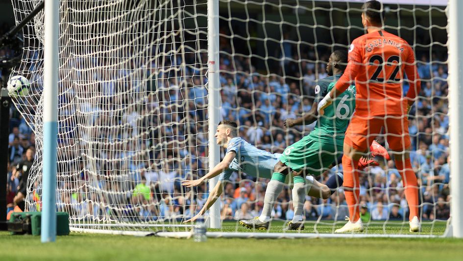 Phil Foden and the ball end up in the back of the net as he scores against Tottenham