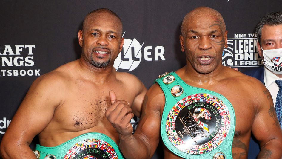 Roy Jones Jr. (L) and Mike Tyson celebrate their split draw
