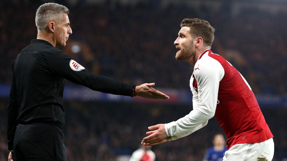 Shkodran Mustafi of Arsenal appeals to an official