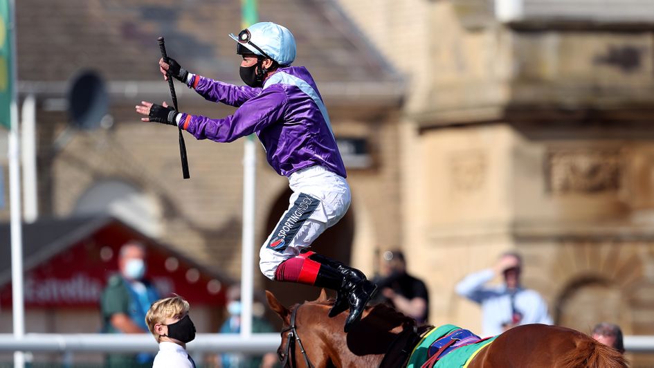 Frankie Dettori performs his trademark flying dismount at Doncaster