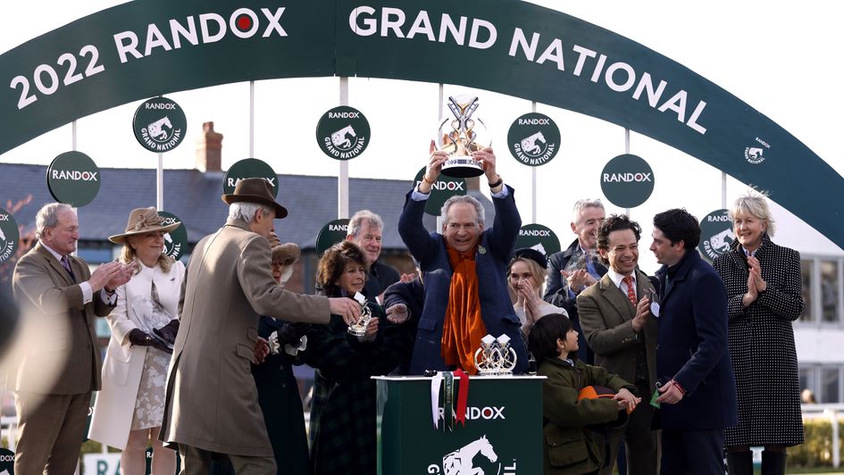 Robert Waley-Cohen holds the Grand National trophy aloft