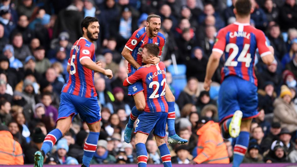 Cenk Tosun celebrates his goal for Crystal Palace at Manchester City