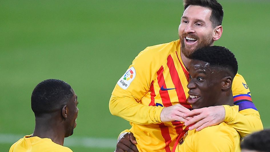 Ilaix Moriba is congratulated by Lionel Messi
