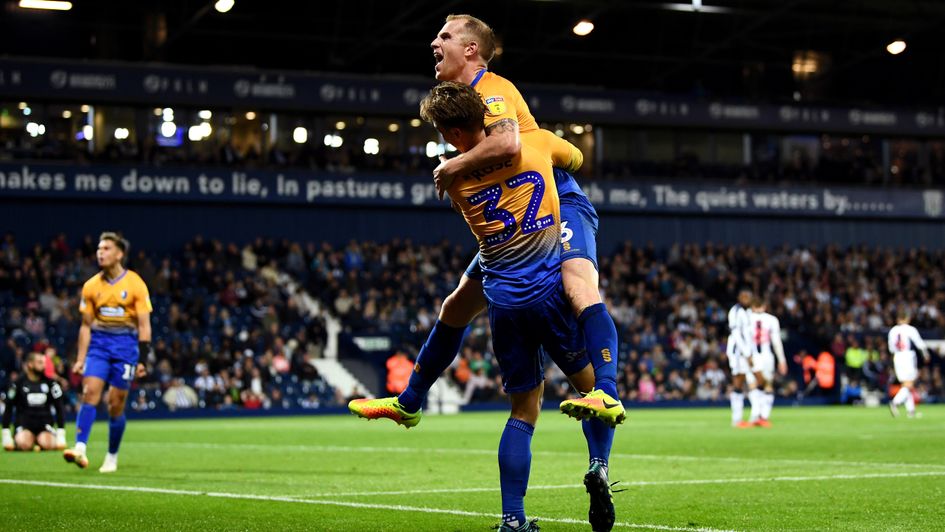 Mansfield Town, pictured celebrating a goal against West Brom in the Carabao Cup