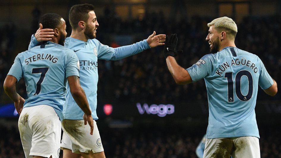 Sergio Aguero (right) celebrates his hat-trick for Manchester City against Arsenal