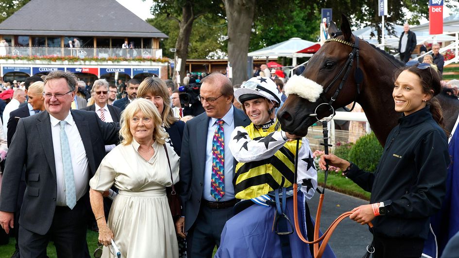 Proud trainer Michael Dods (far left) pictured after Arapaho Gold's Gimcrack success