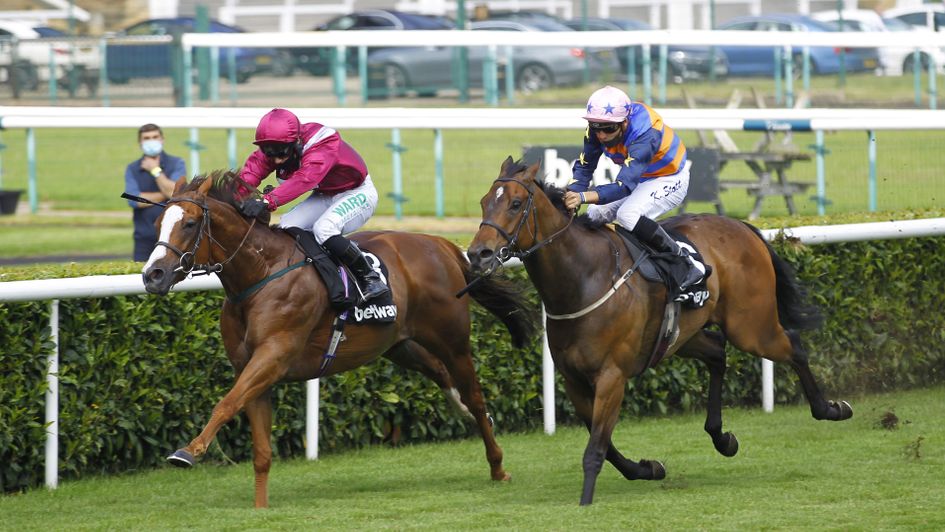 El Astronaute (left) digs deep to score at Doncaster