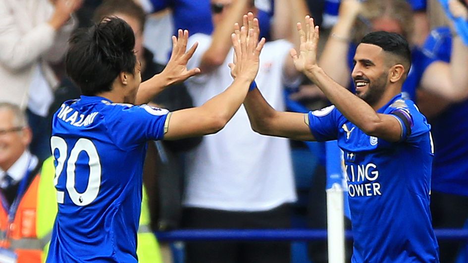 Shinji Okazaki celebrates his early goal v Brighton with Riyad Mahrez