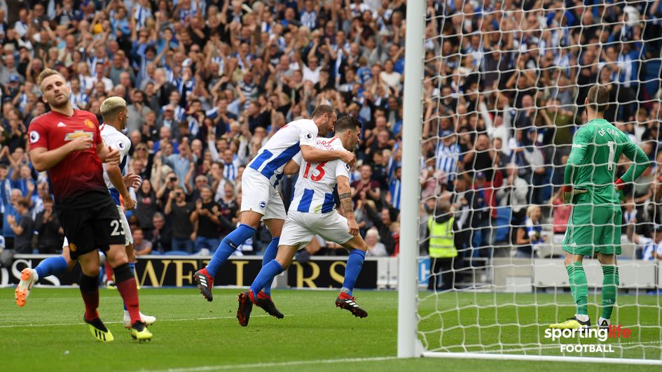 Pascal Gross celebrates scoring his penalty against Manchester United