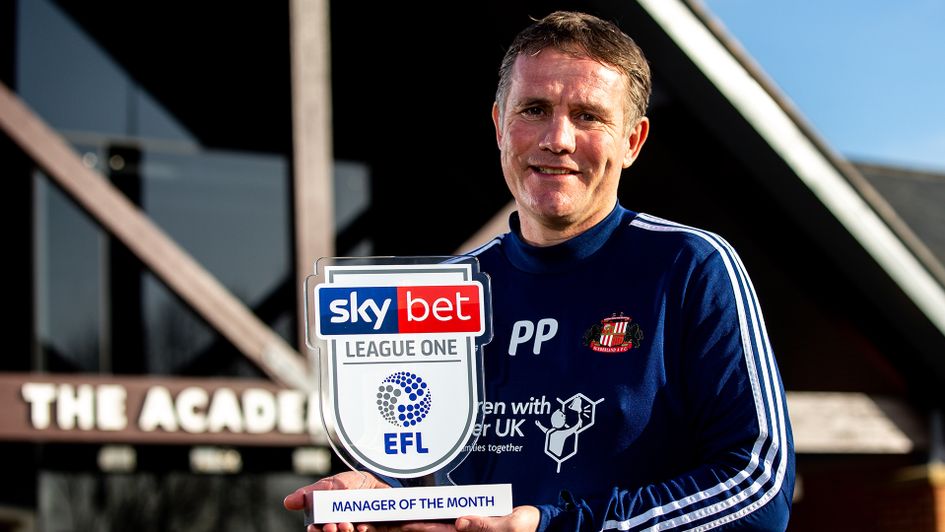 Phil Parkinson with the Sky Bet League One Manager of the Month award