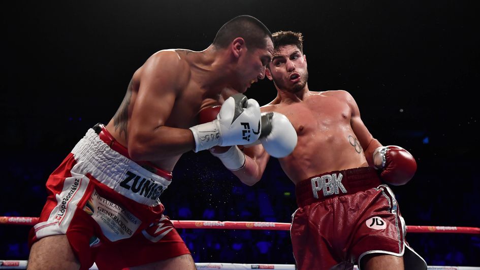 Josh Kelly (right) lands a right hand