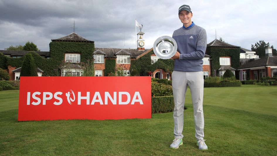 Rasmus Hojgaard holds the UK Championship trophy after winning in a play-off at the Belfry