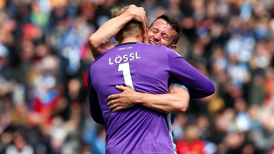 Jonathan Hogg and Jonas Lossl celebrate